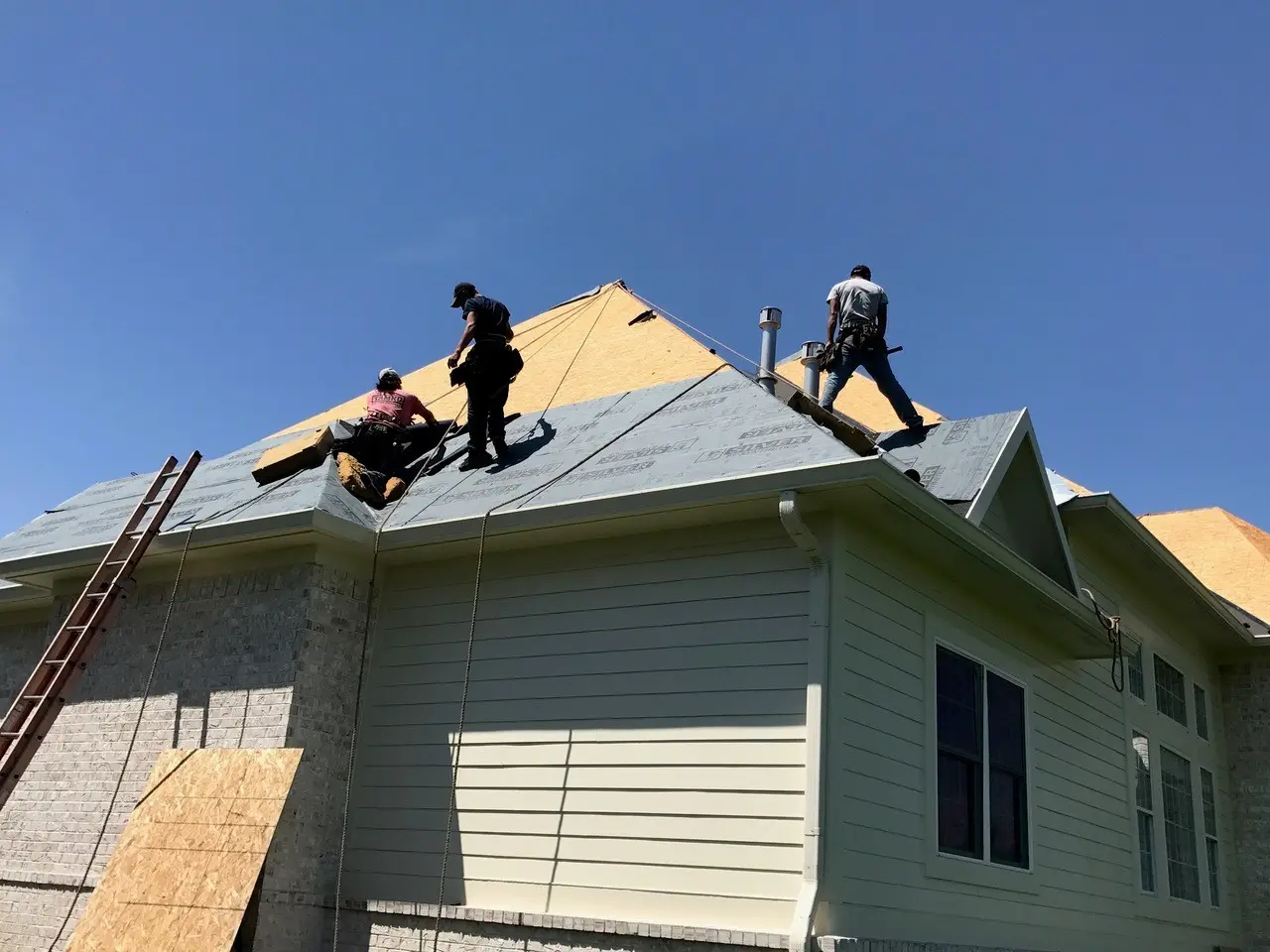 Crew on a fresh roof deck